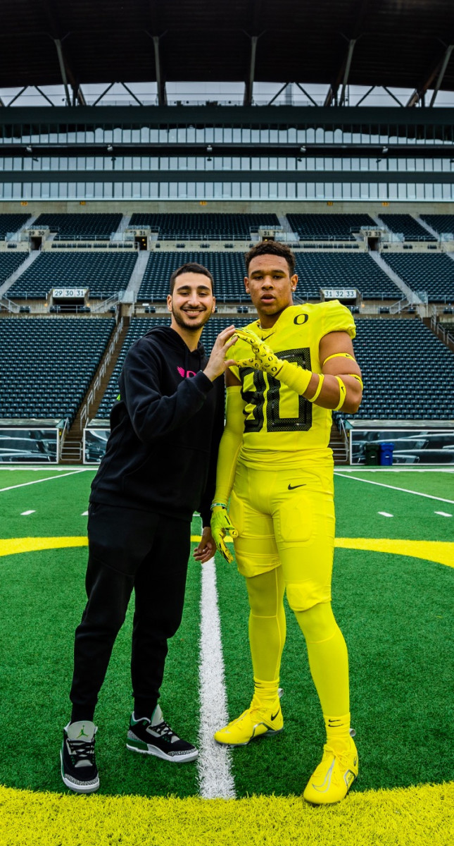 Jaxson Jones poses for a photo inside Autzen Stadium. 